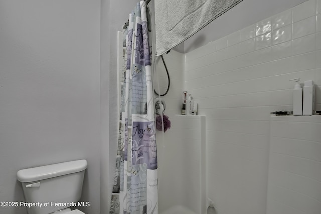 11257 Persimmon Ave, Weeki Wachee, FL 34614 - full bathroom with toilet and a shower with curtain