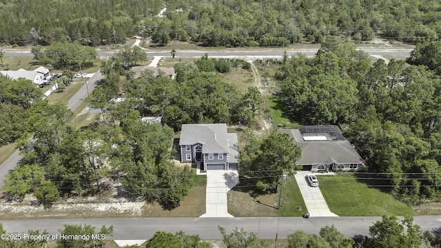 11257 Persimmon Ave, Weeki Wachee, FL 34614 - birds eye view of property with a wooded view