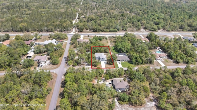 11257 Persimmon Ave, Weeki Wachee, FL 34614 - drone / aerial view featuring a wooded view and a residential view
