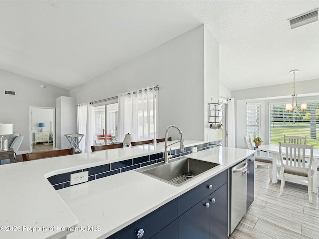 18441 Whitacre Cir, Hudson, FL 34667 - kitchen with visible vents, vaulted ceiling, a notable chandelier, and a sink