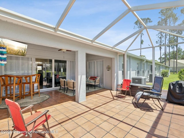 18441 Whitacre Cir, Hudson, FL 34667 - view of patio / terrace featuring a lanai and central AC unit