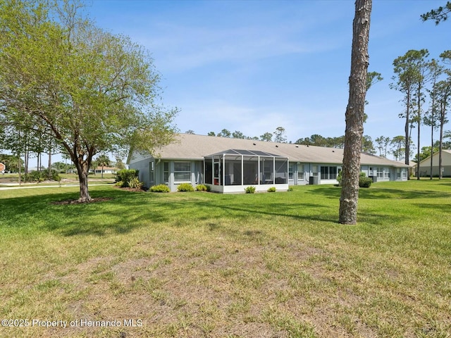 18441 Whitacre Cir, Hudson, FL 34667 - back of property featuring a lawn