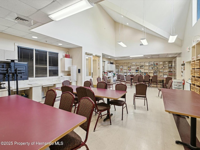 18441 Whitacre Cir, Hudson, FL 34667 - dining area with visible vents, recessed lighting, and a towering ceiling