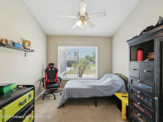 bedroom featuring baseboards, ceiling fan, and carpet floors