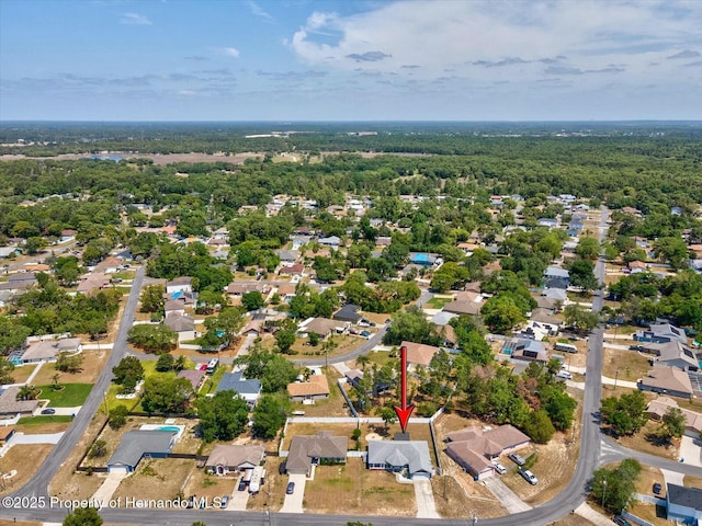 aerial view featuring a residential view and a forest view