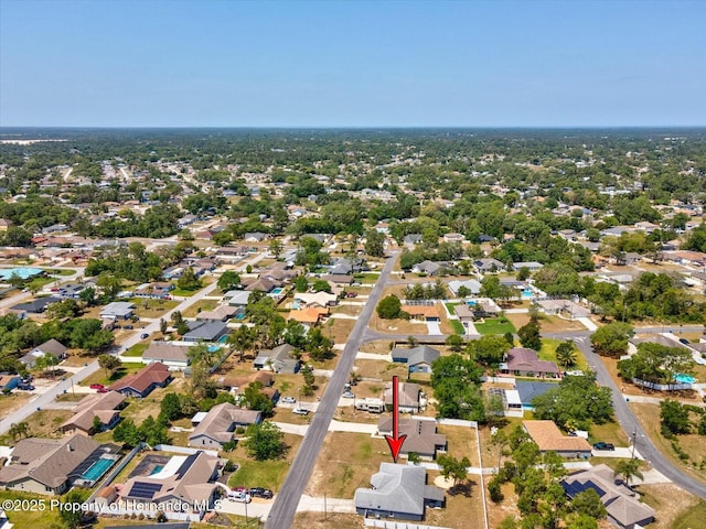 birds eye view of property with a residential view