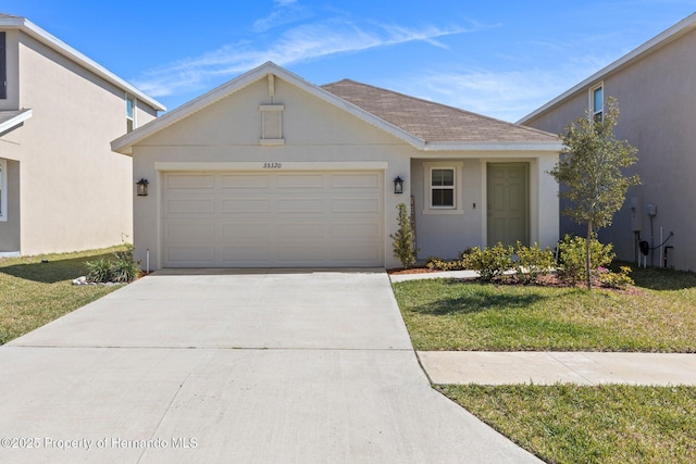 single story home featuring a garage, a front lawn, stucco siding, and concrete driveway