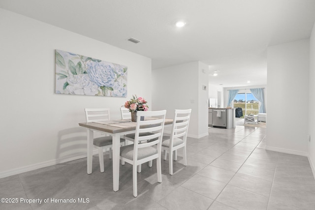 dining room featuring light tile patterned floors, visible vents, recessed lighting, and baseboards