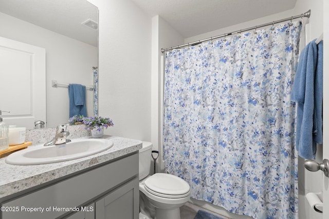 full bathroom with visible vents, toilet, curtained shower, and vanity