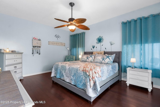 bedroom featuring baseboards, ceiling fan, and wood finished floors