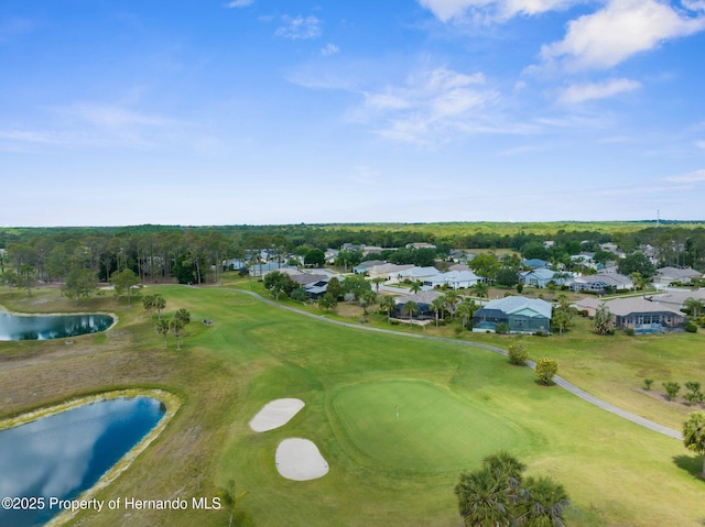 birds eye view of property with a water view, view of golf course, and a residential view