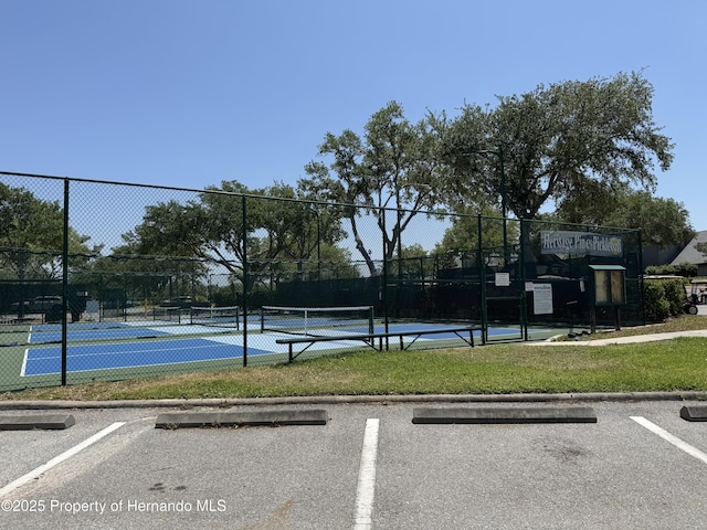 view of sport court with fence