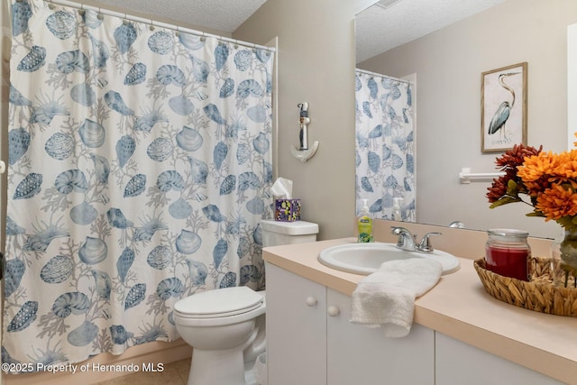 7423 Woodhollow Rd, Spring Hill, FL 34606 - full bath with vanity, tile patterned flooring, toilet, a shower with shower curtain, and a textured ceiling