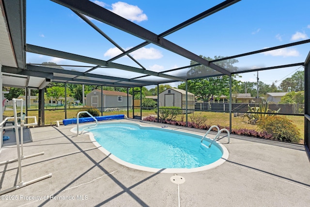 6424 Ponder Dr, Port Richey, FL 34668 - outdoor pool with a patio, an outdoor structure, a lanai, and a storage shed