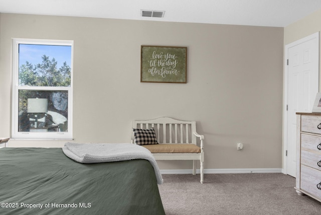 bedroom featuring visible vents, carpet, and baseboards