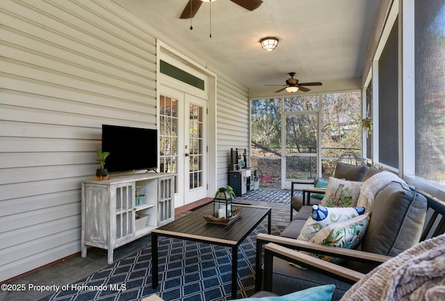 sunroom / solarium with french doors, a ceiling fan, an outdoor hangout area, and a healthy amount of sunlight