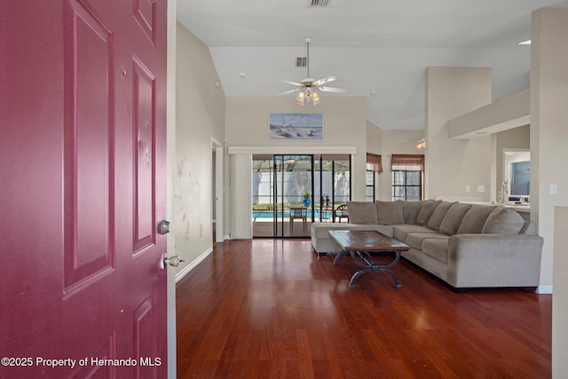 living room featuring high vaulted ceiling, baseboards, a ceiling fan, and wood finished floors