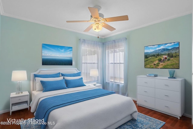 bedroom featuring crown molding, baseboards, ceiling fan, and wood finished floors