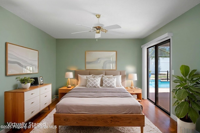 bedroom featuring baseboards, a ceiling fan, wood finished floors, and access to exterior