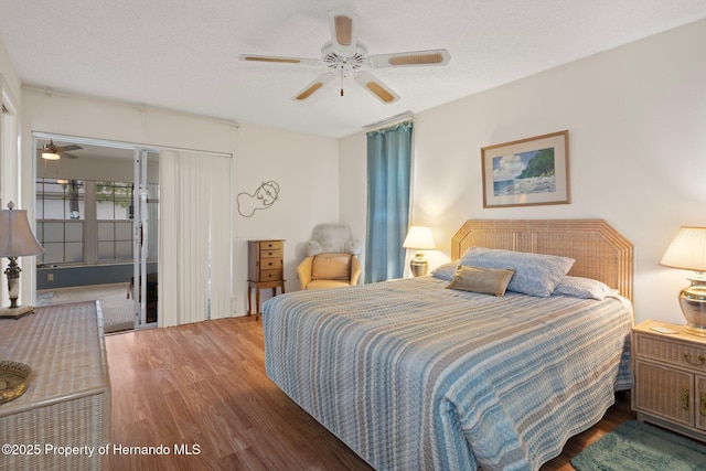 bedroom featuring ceiling fan and wood finished floors