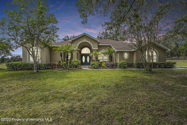 3011 Endsley Rd, Brooksville, FL 34604 - single story home featuring a yard and stucco siding