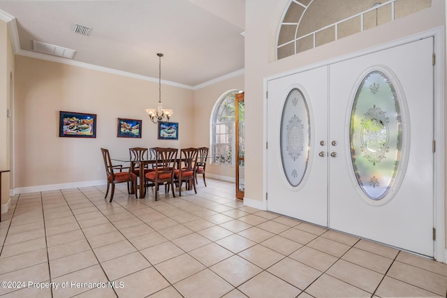 3011 Endsley Rd, Brooksville, FL 34604 - entryway featuring an inviting chandelier, light tile patterned floors, visible vents, baseboards, and ornamental molding