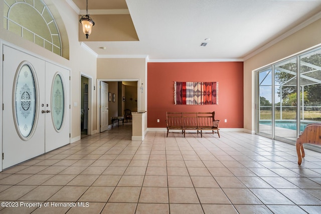 3011 Endsley Rd, Brooksville, FL 34604 - foyer featuring baseboards, ornamental molding, visible vents, and light tile patterned flooring