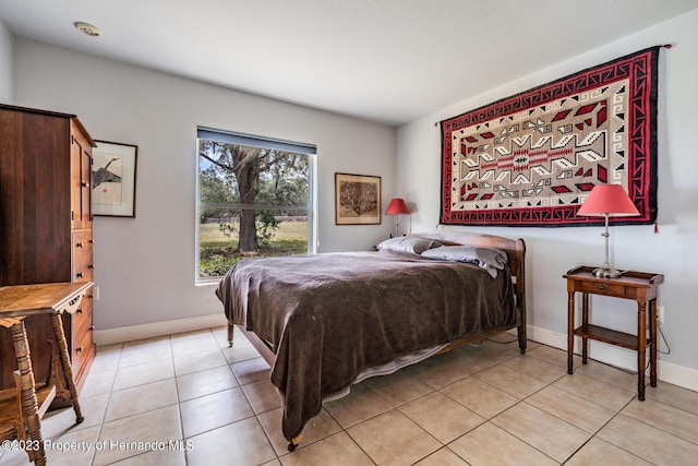 3011 Endsley Rd, Brooksville, FL 34604 - bedroom with light tile patterned flooring and baseboards