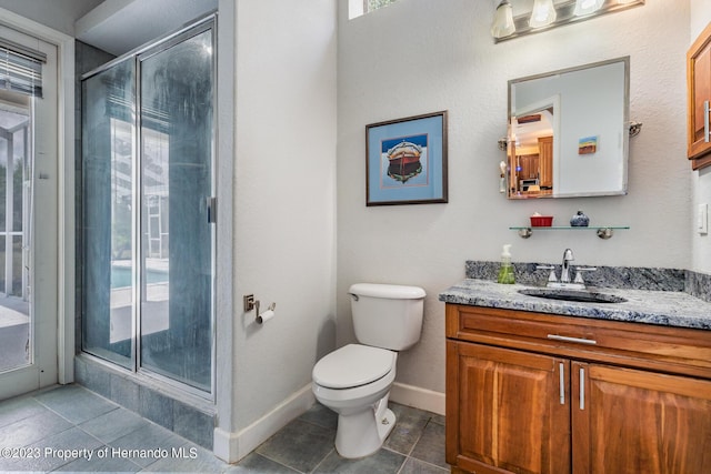 3011 Endsley Rd, Brooksville, FL 34604 - full bath with a stall shower, tile patterned floors, vanity, and toilet