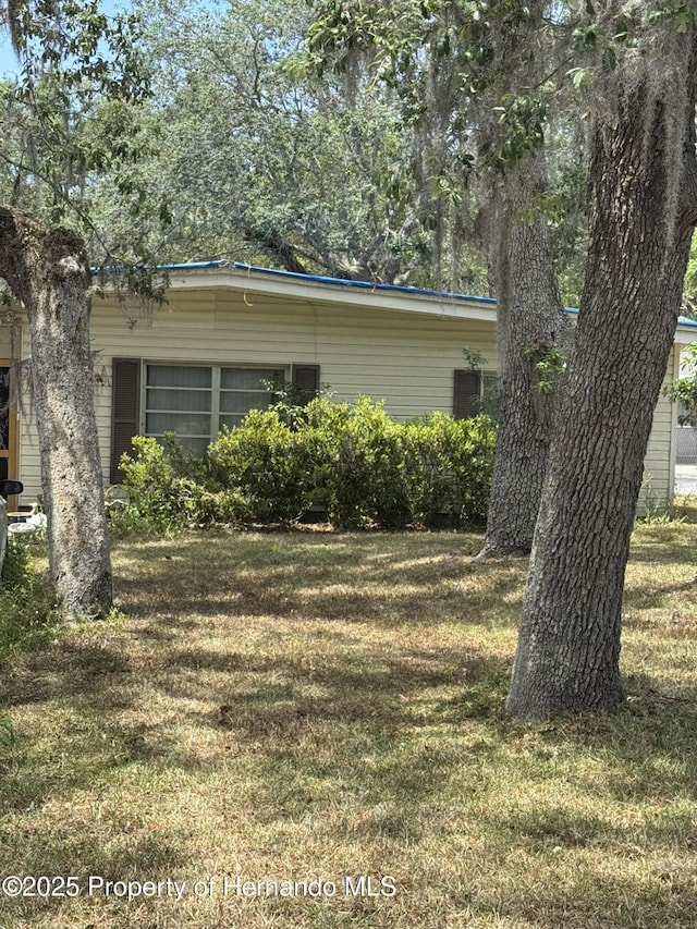 view of home's exterior featuring a lawn