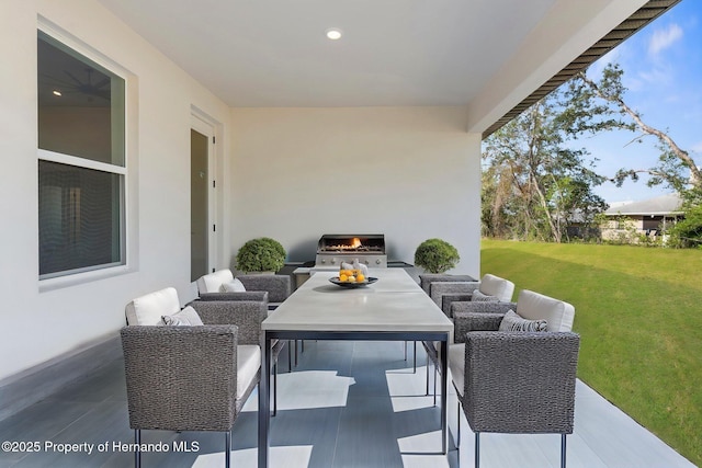 14042 Amero Ln, Spring Hill, FL 34609 - view of patio / terrace featuring an outdoor living space with a fireplace and grilling area