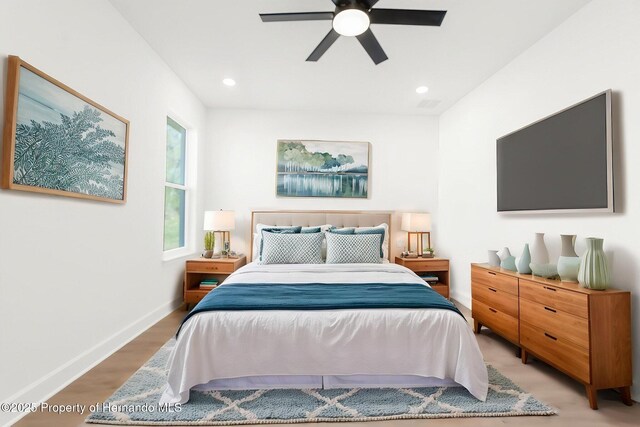14042 Amero Ln, Spring Hill, FL 34609 - bedroom with wood finished floors, baseboards, a ceiling fan, and recessed lighting
