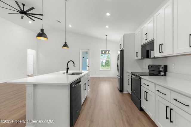 14042 Amero Ln, Spring Hill, FL 34609 - kitchen with freestanding refrigerator, light wood-style flooring, a sink, dishwashing machine, and black electric range