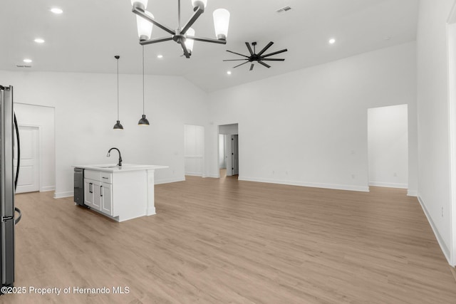 14042 Amero Ln, Spring Hill, FL 34609 - unfurnished living room featuring a sink, an inviting chandelier, visible vents, and recessed lighting