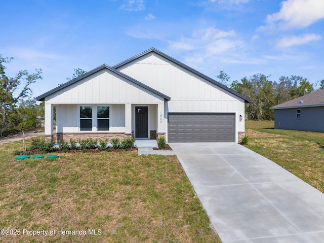 14042 Amero Ln, Spring Hill, FL 34609 - modern inspired farmhouse featuring a front lawn, board and batten siding, a garage, and driveway