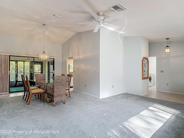 dining area featuring a wealth of natural light, a ceiling fan, a textured ceiling, and visible vents