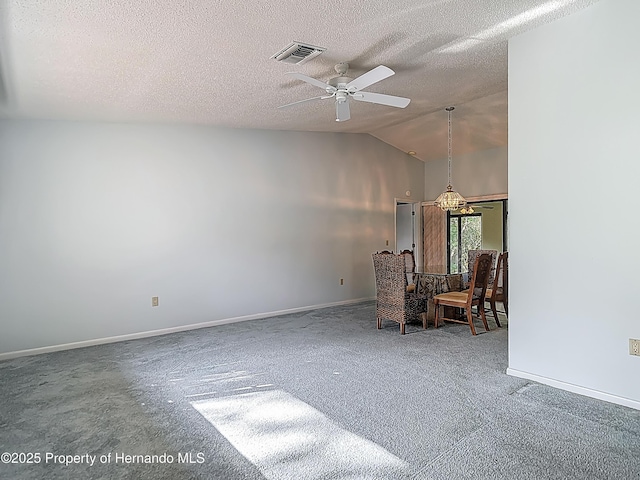 unfurnished room with visible vents, baseboards, ceiling fan, a textured ceiling, and carpet