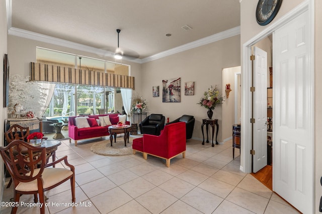 living room featuring crown molding, light tile patterned flooring, and ceiling fan