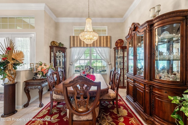 dining room featuring baseboards, an inviting chandelier, plenty of natural light, and light tile patterned floors