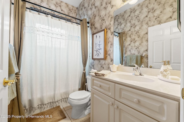 bathroom featuring vanity, tile patterned floors, toilet, shower / bath combo with shower curtain, and wallpapered walls