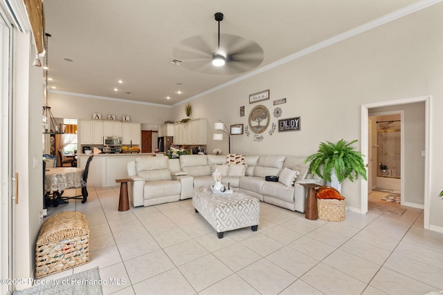 living area featuring recessed lighting, ceiling fan, ornamental molding, and light tile patterned floors