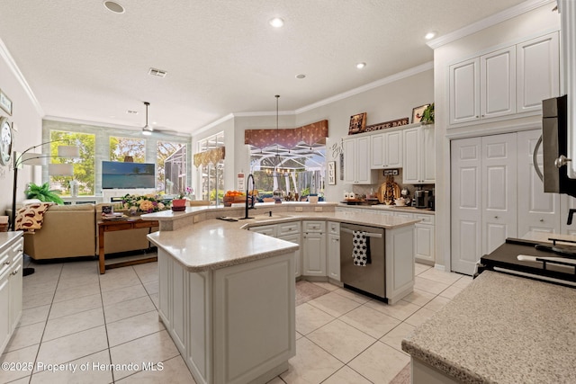 kitchen featuring crown molding, a sink, light tile patterned floors, and stainless steel appliances
