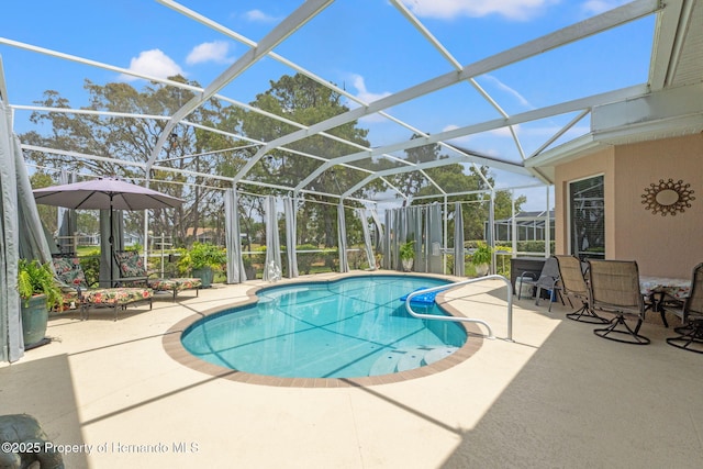 outdoor pool featuring a patio and a lanai