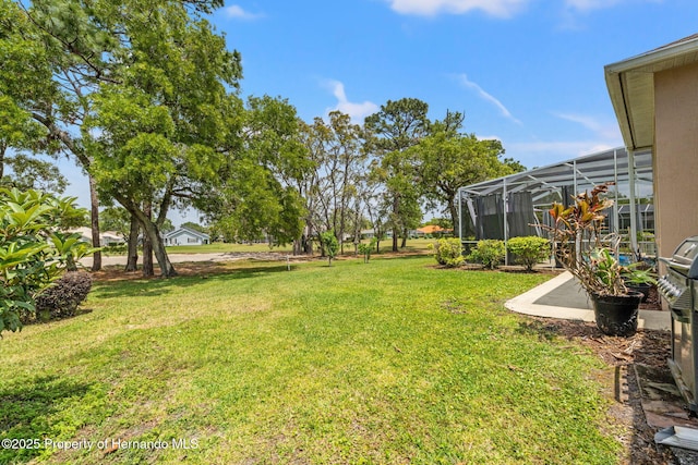 view of yard featuring a lanai