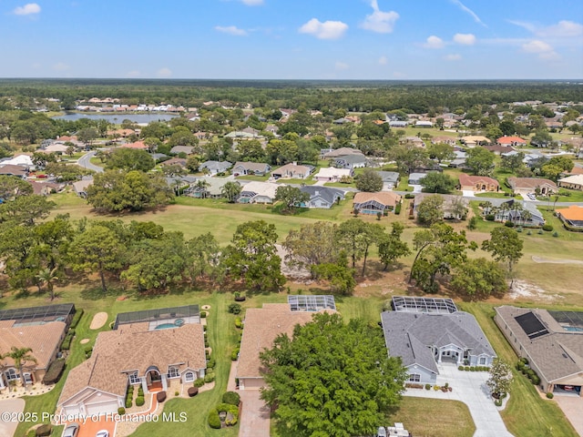 bird's eye view with a water view and a residential view