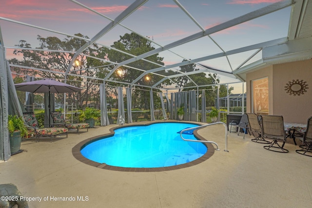 outdoor pool featuring a patio and a lanai