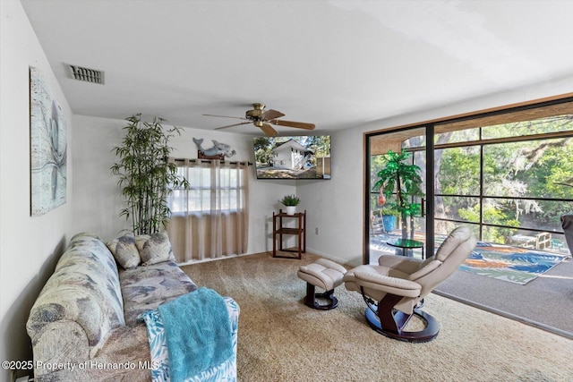 6373 E River Rd, Hernando, FL 34442 - living room featuring visible vents, carpet flooring, a ceiling fan, and a wealth of natural light