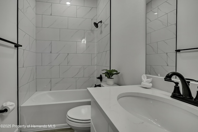 bathroom featuring vanity, bathing tub / shower combination, and toilet