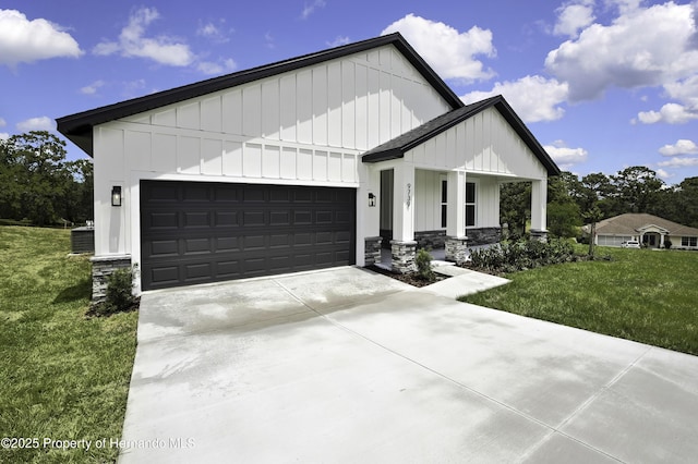 modern farmhouse with board and batten siding, covered porch, driveway, a front yard, and an attached garage