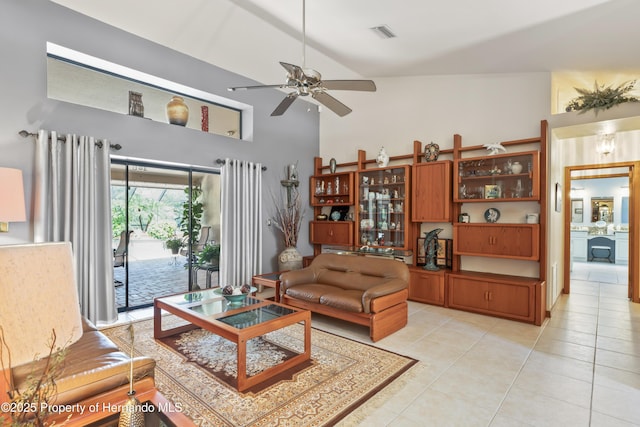 7353 Dogwood, Spring Hill, FL 34607 - living room with light tile patterned floors, visible vents, ceiling fan, and high vaulted ceiling
